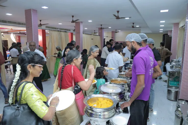 V2W team and families sharing a meal together