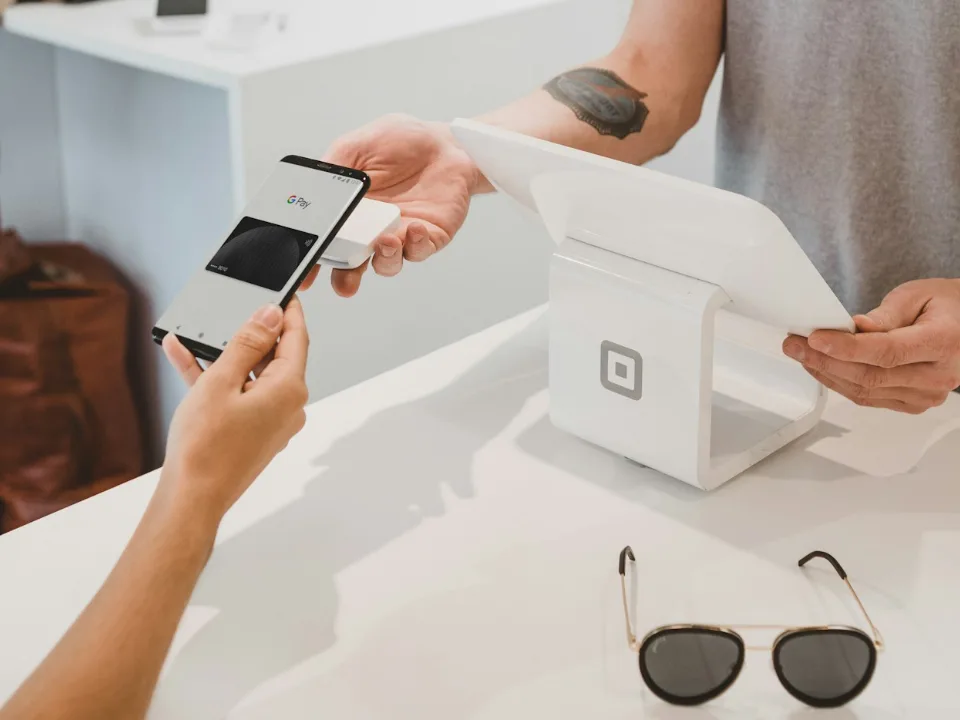 Customer paying online with a card on a laptop